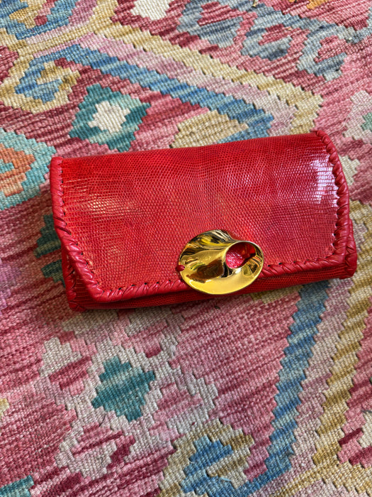 Jasmir, handmade red lizard skin clutch with a sculptural 70s clasp