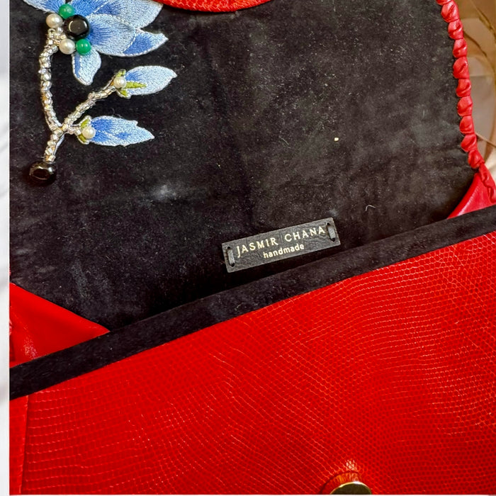 Jasmir, handmade red lizard skin clutch with a sculptural 70s clasp