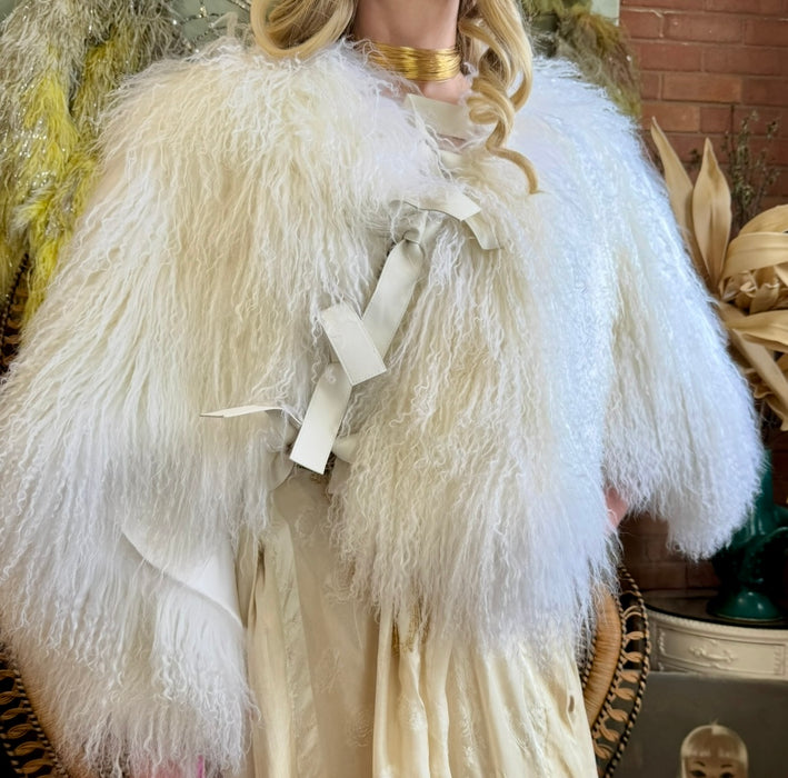 Magnolia, 80s Mongolian fur cream cape with 3 leather ties