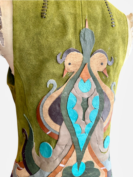 Basil, 70s olive green suede waistcoat with leather ties and handmade folk leather appliqué