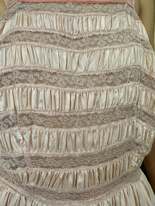 Janet Reiger, blush pink silk and lace dress