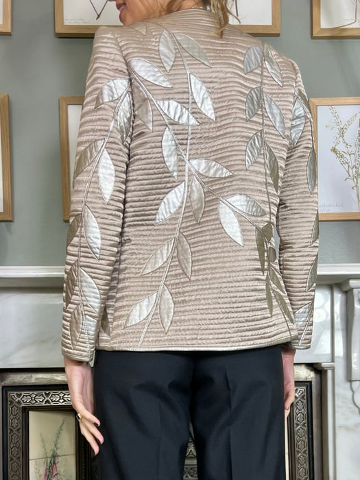 Lisandro Sarasola, leather leaf appliqué jacket and skirt