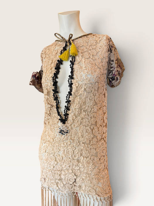 Odette, reworked 1940s cream lace fringed mini dress with 20s black jet beaded keyhole design.