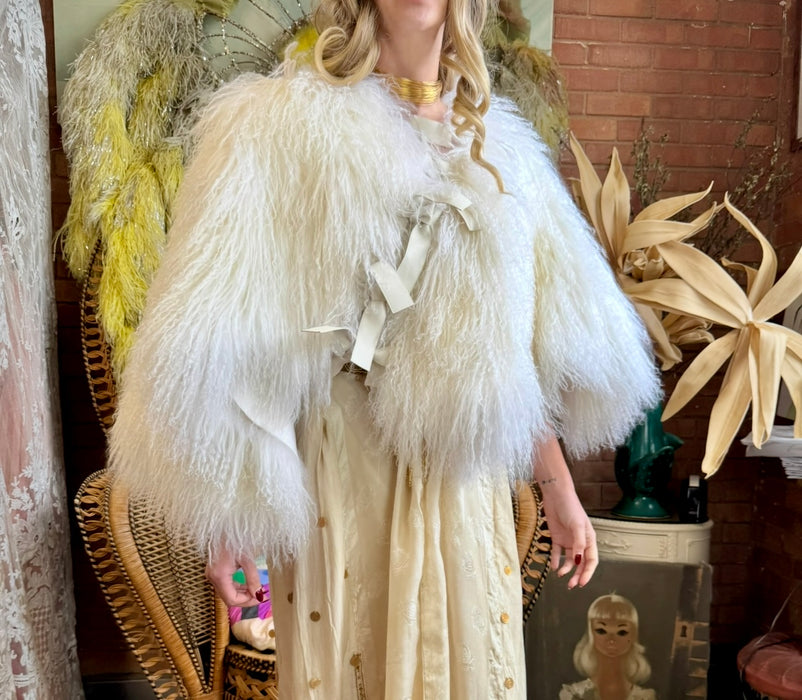 Magnolia, 80s Mongolian fur cream cape with 3 leather ties