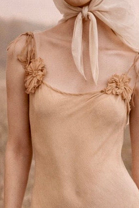 Laine, bias cut silk chiffon and pink dyed handkerchief dress with rosettes