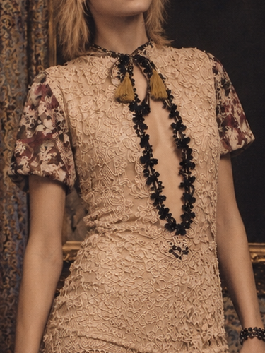 Odette, reworked 1940s cream lace fringed mini dress with 20s black jet beaded keyhole design.