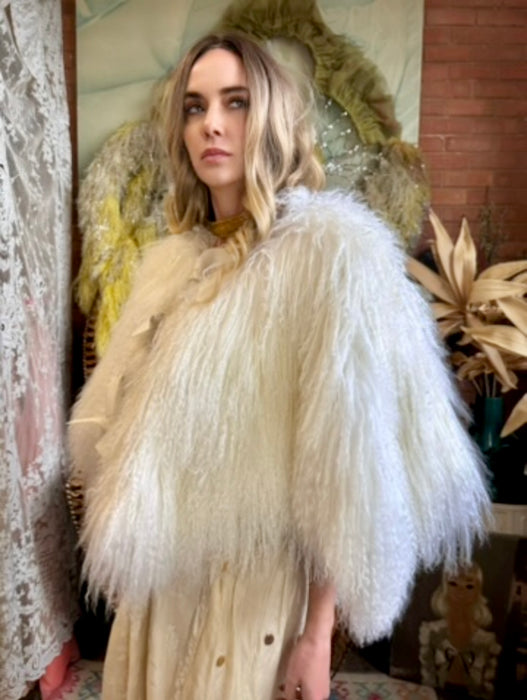 Magnolia, 80s Mongolian fur cream cape with 3 leather ties