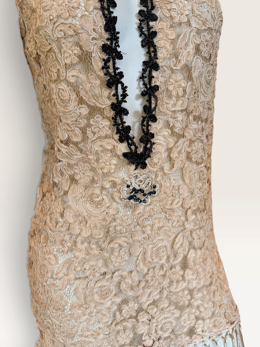 Odette, reworked 1940s cream lace fringed mini dress with 20s black jet beaded keyhole design.