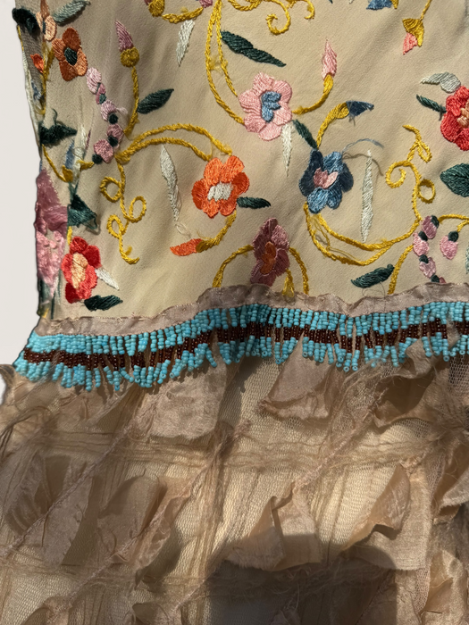 Kali, reworked embroidered piano shawl dress with brass choker and 20s sheered metallic skirt