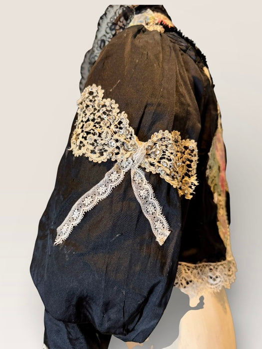 Kiki, Victorian black silk jacket with mutton sleeves, embellished with beaded lace
