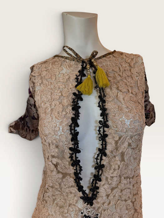 Odette, reworked 1940s cream lace fringed mini dress with 20s black jet beaded keyhole design.