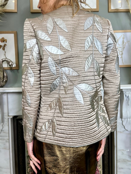 Lisandro Sarasola, leather leaf appliqué jacket and skirt