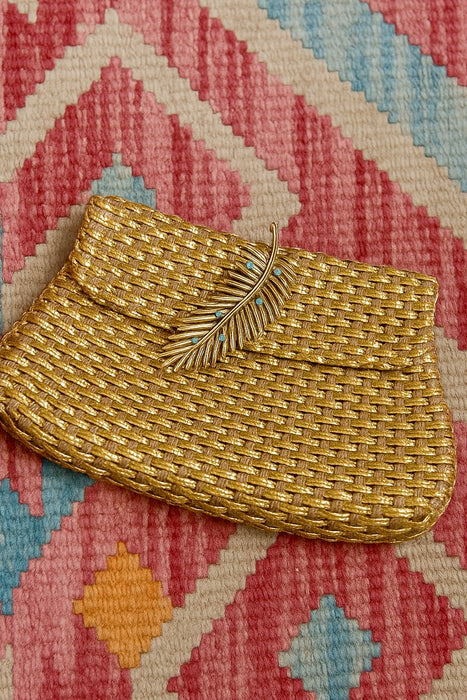 Lola, 70d woven leather clutch with leaf clasp
