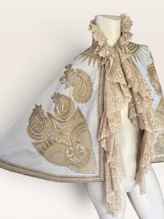 Shay, Ottoman cream and gold embroidered cape with cream lace ruffle collar