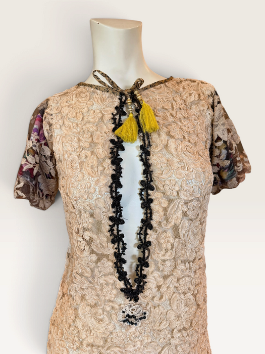Odette, reworked 1940s cream lace fringed mini dress with 20s black jet beaded keyhole design.