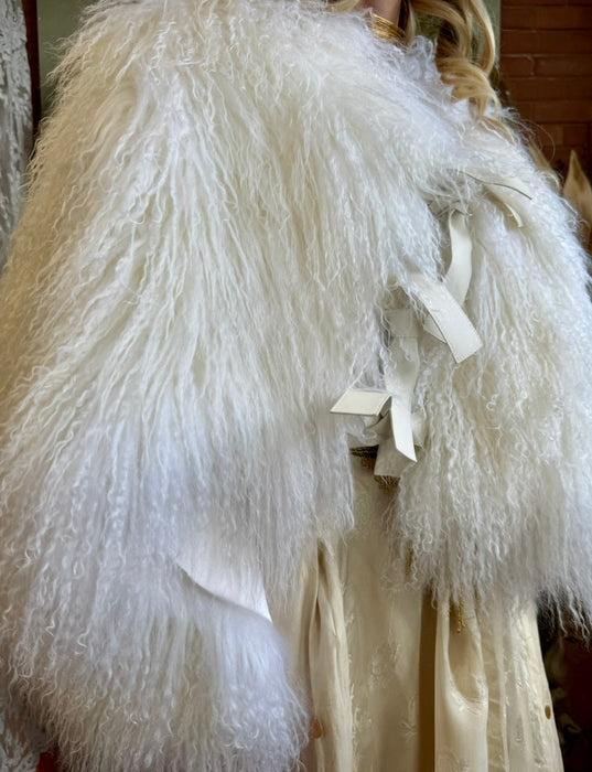 Magnolia, 80s Mongolian fur cream cape with 3 leather ties