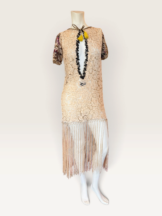 Odette, reworked 1940s cream lace fringed mini dress with 20s black jet beaded keyhole design.