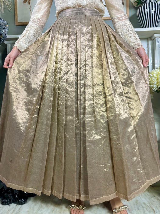 Katherine Cusack, gold lamé pleated skirt