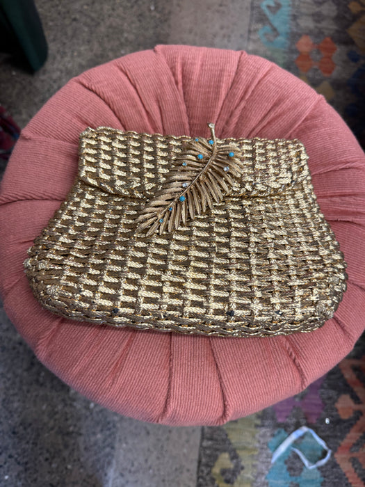 Lola, 70d woven leather clutch with leaf clasp