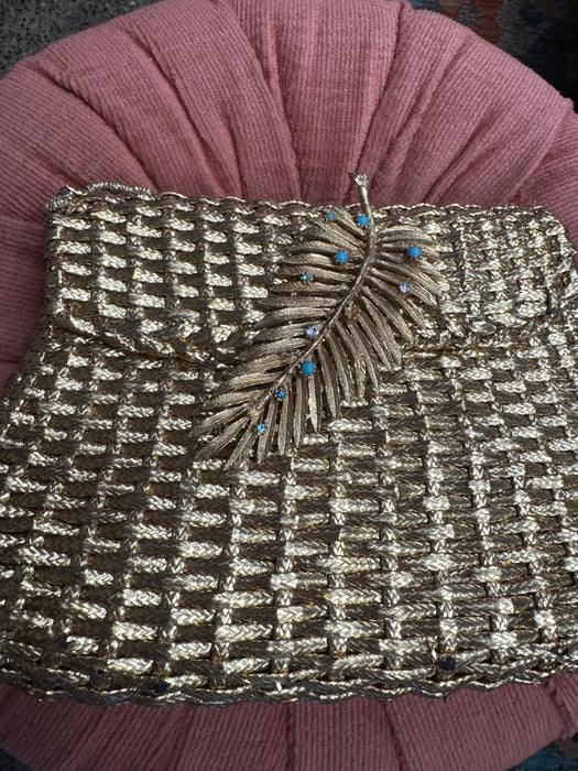 Lola, 70d woven leather clutch with leaf clasp