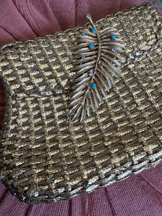 Lola, 70d woven leather clutch with leaf clasp