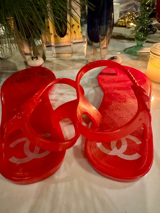 Chanel, red plastic logo flip flops